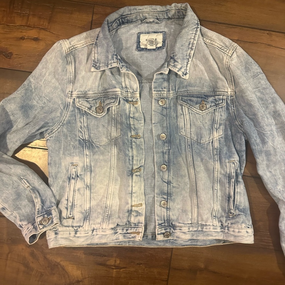 Women’s light wash, jean jacket size medium